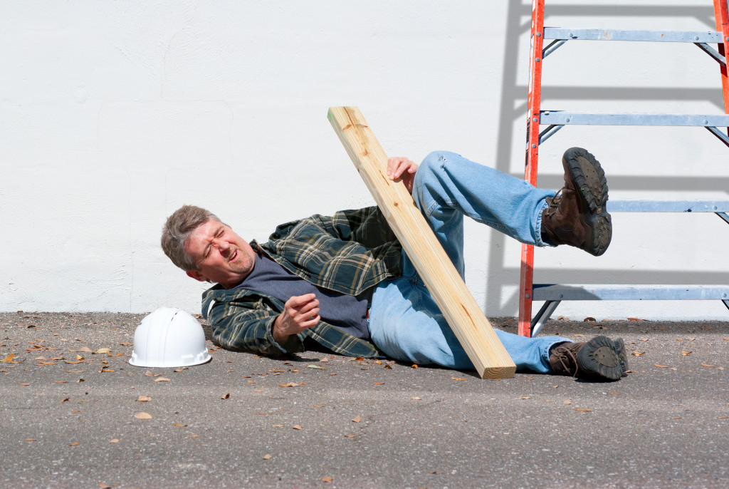 man falling from a ladder